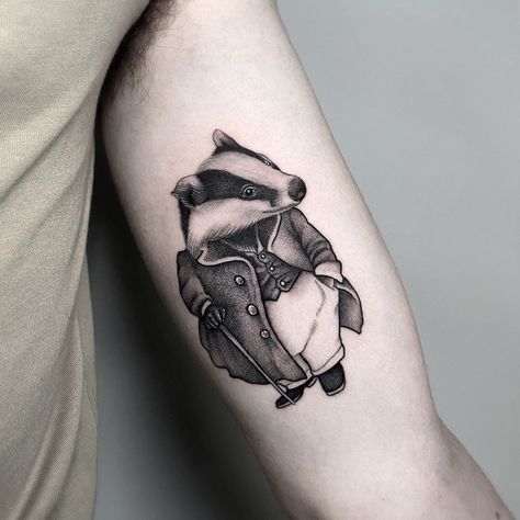 𝓖𝓲𝓷’s Instagram profile post: “First tattoo for Ciarán, Mr. Badger from The Wind in the Willows 🖤 To make an appointment you can contact him directly, call the shop +353…” Wind And The Willows Tattoo, Wind In The Willows Tattoo, Badger Tattoo, Tattoo Symbolism, The Wind In The Willows, Wind In The Willows, Doll Tattoo, Wing Tattoo Designs, Wing Tattoo