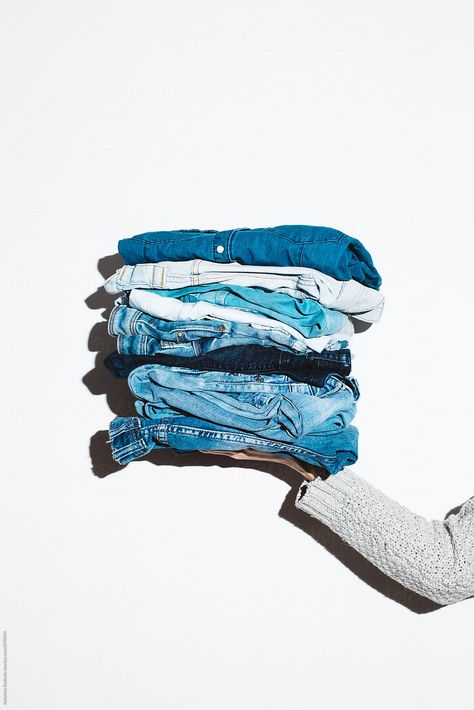 Woman Holding A Pile Of Denim Download this high-resolution stock photo by Katarina Radovic from Stocksy United. What Is Fast Fashion, Denim Photography, Denim Photoshoot, Denim Studio, Denim Shirt Outfit, Clothing Swap, Creative Fashion Photography, Wardrobe Planning, Clothing Photography