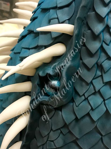 Blue tonal dragon scale cake  The eye of a dragon in cake  Visit the link below Dragon Scale Cake, Fondant Dragon, Cake Dragon, Dragon Birthday Cakes, Dragon Cake, Castle Cake, Dragon Birthday, Dragon Scales, Dragon Party