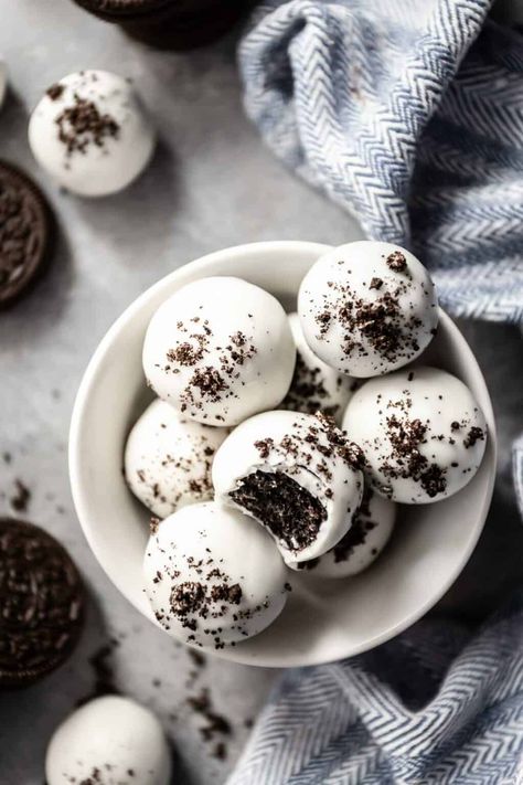 These easy Oreo balls are a delicious 3-ingredient chocolate treat for when you need a last-minute dessert. Choose your favorite flavor of Oreo cookies, combined with brick cream cheese, and dunked in chocolate. Keep plain or top with sprinkles, chocolate drizzle or crushed Oreos. This no-bake Oreo balls recipe is guaranteed to be hit no matter the occasion! #oreoballs #oreotruffles Texas Sheet Cake Frosting, Sheet Cake Frosting, Oreo Ball Recipe, Oreo Balls Recipe 3 Ingredients, Boiled Frosting, Oreo Truffle Balls, Easter Oreo, Oreo Cake Balls, Oreo Bites