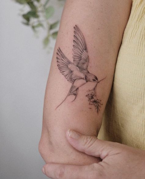 Lilly And Bird Tattoo, Sparrow Tattoo Forearm, Sparrow And Wildflower Tattoo, Floral Bird Tattoo Design, Bird And Lily Tattoo, Bird Carrying Flower Tattoo, Lilly And Sparrow Tattoo, Bird Holding Flower Tattoo, Tattoo Themes For Women