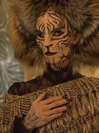 Tigris | The Hunger Games Wiki | Fandom Hunger Games Tigris, Hunger Games Hair, Hunger Games Makeup, Hunger Games Capitol, Hunger Games Costume, Snow Tattoo, Hunger Games Party, Hunger Games Fashion, Mockingjay Part 2