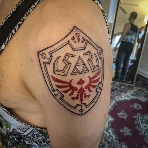 Hylian Shield Tattoo, Legend Of Zelda Tattoo, Zelda Shield, Fine Line Tattoo Ideas, Shield Tattoo, Hylian Shield, Zelda Tattoo, Line Tattoo Ideas, Black Line