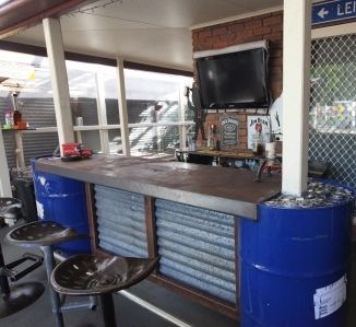 Front section of the Bar made from 44 gallon drums, with tractor seat stools. Kick rail S/steel. Designed and Built by John BuggerMe Designs. https://www.facebook.com/BuggerMeDesigns 44 Gallon Drum Ideas, 55 Gallon Drum Ideas, Club Design Interior, Drum Seat, Jerry Can Mini Bar, Barrel Projects, Barrel Bar, Diner Decor, 55 Gallon Drum