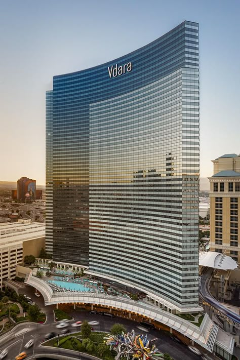 Sophistication and international flair are at the Vegas skyline with Vdara Hotel & Spa. Designed by world-renowned RV Architecture, the all-suite, nonsmoking, non-gaming boutique hotel and spa offers exclusivity with modern amenities and services. Luxury Hotel Exterior, Vdara Hotel Las Vegas, Hotel Building Design, Chocolate Architecture, Hotel Exterior Design, Vdara Hotel, Casino Architecture, Hotel Architecture Design, Penthouse Hotel