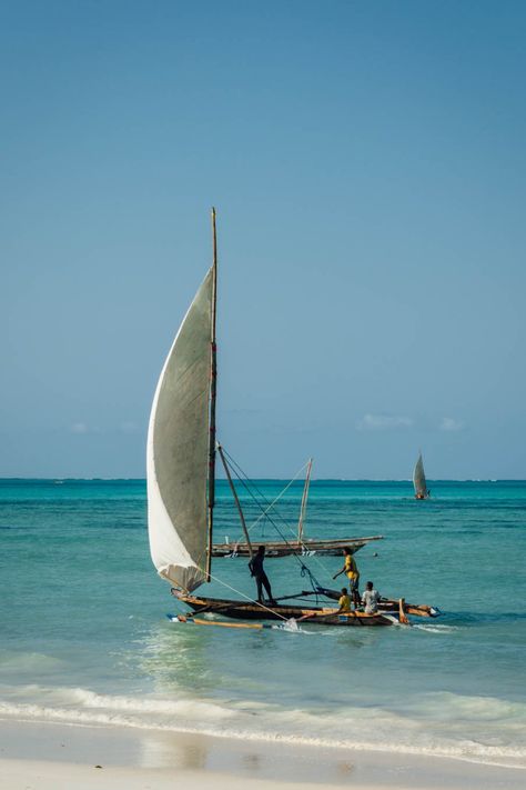 traditional dhow boat with sail on turqoise ocean Zanzibar Boat, Zanzibar Photography, Zanzibar Aesthetic, Zanzibar Itinerary, Zanzibar Travel, Boat Sunset, Zanzibar Tanzania, Tanzania Travel, Destination Photography