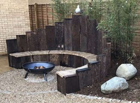 Old Railway sleeper curved bench and raised beds Railway Sleepers Garden, Sleepers In Garden, Outdoor Fire Pit Seating, Outdoor Fire Pit Area, Old Railway, Outdoor Fire Pit Designs, Curved Bench, Fire Pit Landscaping, Garden Railway