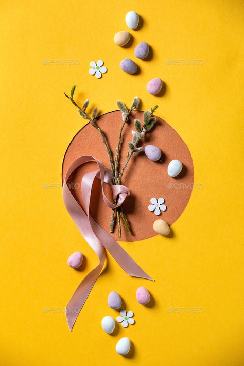 Easter greeting card by NatashaBreen. Easter greeting card with blossom willow branches, colorful candies on bright orange yellow background. Flat lay, cop... #AD #willow, #blossom, #colorful, #branches Easter Product Photoshoot, Easter Aesthetic Photography, Easter Product Photography, Orange Yellow Background, Easter Shoot, Easter Photography, Easter Photoshoot, Easter Greeting, Willow Branches