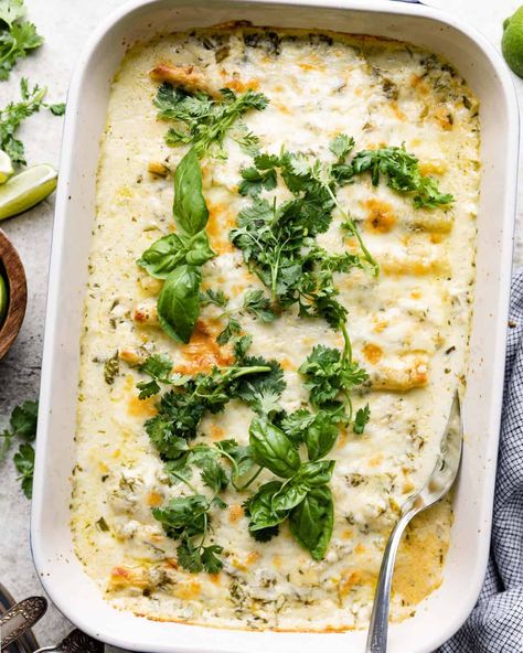 These Green Chile Beef Enchiladas with Cilantro Cream Sauce are the perfect hearty weeknight dinner. The sour cream based sauce is loaded with cilantro, lime, green chiles, and lots of cheese. The enchiladas are filled with flavorful taco meat and even more cheese. You can’t beat a pan of this cheesy saucy goodness. Enchiladas White Sauce, Green Chile Beef, Cilantro Cream Sauce, White Sauce Enchiladas, Mild Taco Seasoning, Braised Chicken Breast, Lime Chicken Tacos, Ground Beef Enchiladas, Sour Cream Sauce