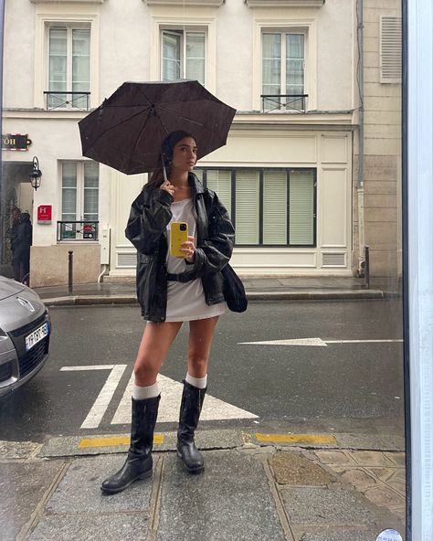 rainy paris fit long t shirt belt grunge biker boots long socks fitspo fashion girlies Long Socks With Boots Outfit, Skirt And Biker Boots Outfit, Black Motorcycle Boots Outfit, Rainy Street Style, Mui Mui Boots Outfit, Tall Boots Summer Outfit, Knee High Biker Boots Outfit, Miumiu Boots Outfit, Outfits With Moto Boots