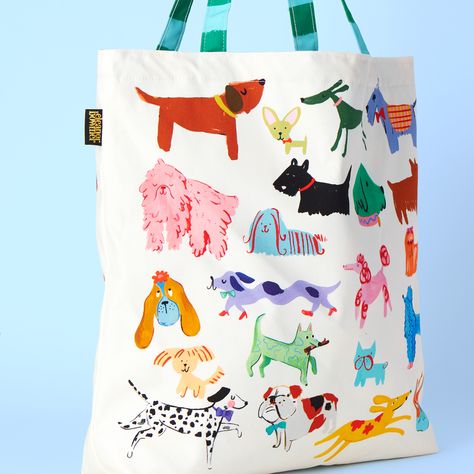 Carry your essentials in style with our Dog Club Tote Bag. Cream with cute dog illustrations, it features strong striped handles for durability. The inside boasts a pink and blue star pattern, while the water-resistant lining keeps your items safe. Ideal for dog lovers on the go. Product Specification: This bag is 50cm x 50cm Made in the UK 100% cotton. 300 grams. Half panama fabric. Iron inside out and wash at 30 degrees. 30 Day Art Challenge, Kids Room Accessories, Dog Illustrations, Canvas Bag Design, Rene Gruau, Dog Club, Dog Tote Bag, Dog Tote, Illustration Cute