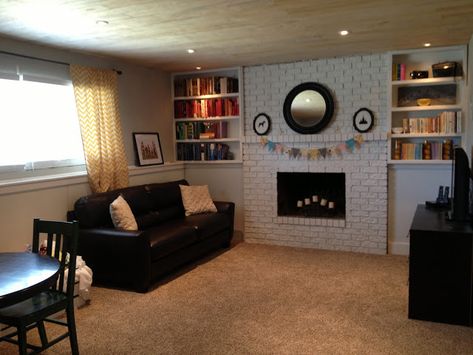 Keep Home Simple: Our Split Level Fixer Upper. I like the books around the fireplace. Split Level Basement, Basement Remodel Ceiling, Basement Built Ins, Raised Ranch Remodel, Homeschool Space, Basement Window, Split Level Remodel, Ranch House Remodel, Split Foyer