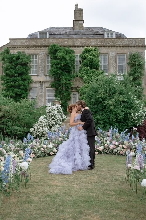 Bride and groom kissing in front of grounded floral arch. Single Stem Wedding Aisle, Single Stem Flower Aisle, Single Stem Aisle Flowers, Single Stem Aisle, Wedding Ground Florals, Ground Arch Wedding, Ground Floral Arch, Grounded Floral Arches, Grounded Arch