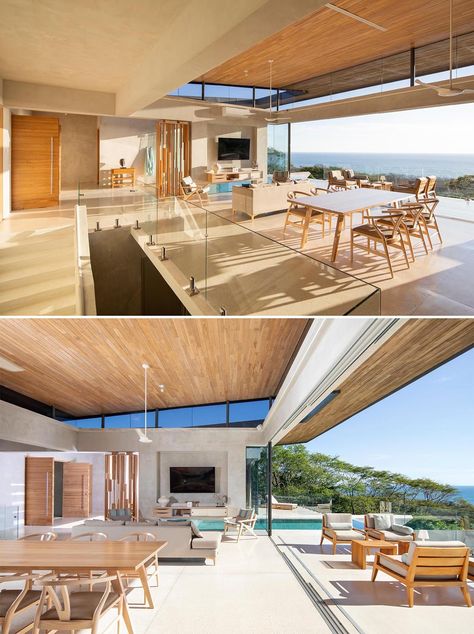 Inside this modern home, the main social areas include an open floor plan with the large wood ceiling floating over the space. Santa Teresa Costa Rica, Concrete Staircase, Horizontal Mirrors, Hidden Lighting, Roof Overhang, Tropical Sun, Room With Plants, Wood Ceilings, Story House