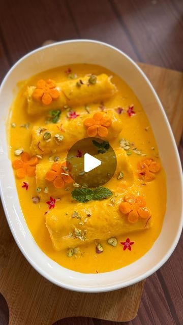 Pooja Savardekar on Instagram: "Mango Malai Rolls : Indulge in the lusciousness of summer with these Quick Mango Malai Rolls! Soft, creamy, and bursting with the flavor of fresh mango, they’re the perfect dessert to cool off and satisfy your sweet tooth. 🌞🥭   Ingredients:  - 1 cup milk - 2-3 tbsp sugar - 2 tbsp custard powder - 1/2 cup mango pulp - Saffron milk - 1/4 cup paneer - 1/4 cup malai or cream - 2 tbsp powdered sugar - 6 slices of bread - Mango pieces - Chopped nuts  1. Custard - Boil 1 cup milk, add 2-3 tbsp sugar. Mix 2 tbsp custard powder with milk, pour into boiling milk, cook for 30 secs. Cool, then mix in 1/2 cup mango pulp and saffron milk. Set aside.  2. Malai Mixture - Blend 1/4 cup paneer and 1/4 cup malai or cream until smooth. Mix in 2 tbsp powdered sugar.  3. Rolls Mango Pulp Dessert, Paneer Dessert Recipes, Mango Custard, Saffron Milk, Pulp Recipe, Mango Pulp, Mango Dessert, Custard Powder, Slice Of Bread