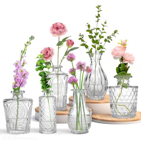 PRICES MAY VARY. Versatile and Stylish: These glass bud vases are perfect for adding a touch of elegance to any occasion, from weddings to home decor. Perfect Size for Flowers: With their small size, these glass flower vase are ideal for displaying single flowers or creating stunning floral centerpieces. Durable and Clear: Made from high-quality glass, these glass vases are sturdy and transparent, allowing the beauty of your flowers to shine through. Great Value: This bulk pack includes multiple Single Flower Bud Vase, Single Flower Vase Wedding, Small Vase Flower Arrangements, Bridal Shower Floral Centerpieces, Ginger Wedding, Glass Vase Wedding Centerpieces, Decorating With Flowers, Small Vases With Flowers, Bud Vases Arrangements