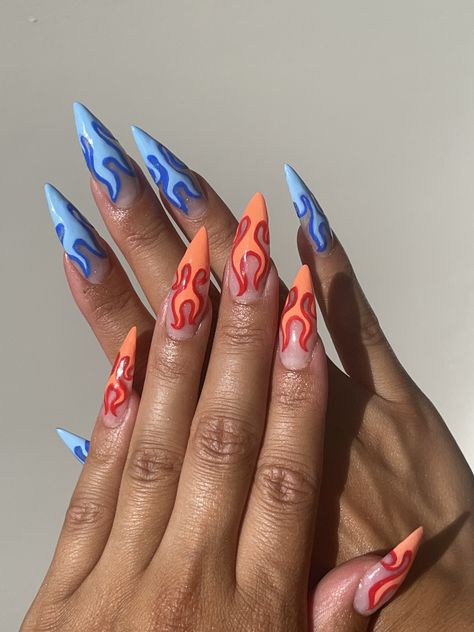 Nail design, blue flame nails and orangy red flame nails Short Flame Nails Designs, Blue Fire Nails Designs, Grey Flame Nails, Red And Orange Flame Nails, One Hand Red One Hand Blue Nails, Blue Drip Nails, Fire Themed Nails, Fire Sign Nails, Red And Blue Nails Acrylic