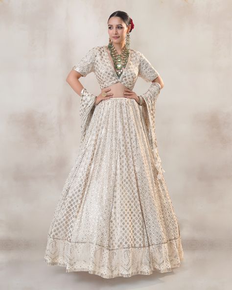 Dream in white @mrunalthakur takes our breath away in Exquisite Nehmat lehenga by @_richaahluwalia as featured in @facemag.in Crafted from luxurious Georgette fabric, the lehenga exudes sophistication and charm. Adorned with delicate Rosegold mukaish work and intricate embroidery, it boasts timeless beauty and craftsmanship. The classic off-white base color serves as the perfect canvas for the heavy mukaish handwork, adding a touch of ethereal grace to your attire. The blouse adds a touch o... Mukaish Work, Grace To You, Dress Indian, Dress Indian Style, Intricate Embroidery, Georgette Fabric, Indian Style, Indian Wear, Base Colour