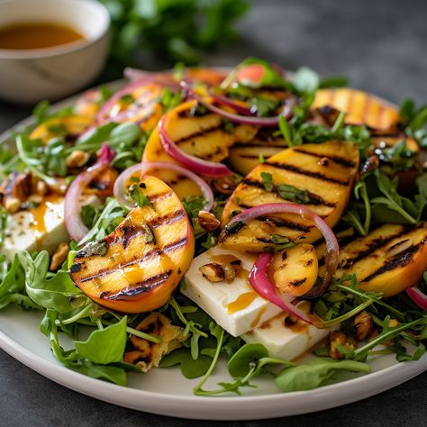 This Grilled Peach and Halloumi Salad is the perfect combination of sweet and savory, and is perfect for outdoor gatherings. With juicy grilled peaches, salty halloumi cheese, and a tangy balsamic glaze, this salad is the perfect way to impress your guests! #GrilledPeachAndHalloumiSalad #SummerRecipe #foodie #delicious #healthy #salad #Mediterranean #vegetarian #recipe #peach #halloumi #mixedgreens #redonions #pecans #balsamicglaze Peach And Halloumi Salad, Halloumi Peach Salad, Chicken Halloumi Salad, Peach Halloumi Salad, Halumi Cheese Grilled Salad, Grilled Halloumi Salad, Hallumi Recipes Salad, Halloumi Salad Recipes, Halloumi Cheese Recipes