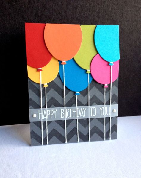 handmade birthday card from Im in Haven ... Penny Black balloon died cut in bright colors with string hanging down ... luv that she made her own chevron stencil using a die cut and acetate for the gray on gray background ... white embossed sentiment on vellum belly band ... great card!