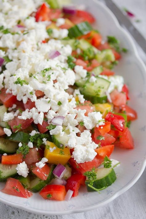 Shopska Salad recipe one of the most popular salads in the Balkan area. Made with tomatoes, cucumber, peppers and feta perfect to use all your delicious summer veggies! #saladrecipe #healthysalad #tomatosalad Balkan Salad, Bulgar Salads, Bakedbymelissa Salad, Middle Eastern Cucumber Tomato Salad, Shopska Salad, Shopska Salad Bulgaria, Cucumber Feta Salad, Ruska Salata Recept, Autumn Salad Recipes