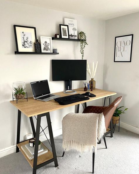 Furnish your home office with this design idea. Assemble black mounted shelves and decorate them with simple neutral dÃ©cor, including black and white framed prints and a small potted plant. Enhance the light gray tones of the walls with a natural wooden desk and fresh potted plants. Floating Shelf Above Desk, Above Desk Ideas, White Office Desk Decor, Floating Shelves Above Desk, Shelf Above Desk, Small Office Ideas Home, Shelves Above Desk, Black And White Home Office, White Wooden Desk