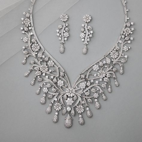 This elegant set features a statement-style floral design, perfect for weddings. Crafted with rhodium-plated copper and adorned with high-quality AAA CZ stones, it adds a touch of glamour to any ensemble. #cassandralynnebridal #wedding #jewelry #bridal #imitationjewelry #costumejewelry #bridaljewelry #bridaljewelryset #weddingplanning #czjewelry #dubaistyle #maximalist #weddingaccessories #bridalaccessories #statementnecklace Gold Headpiece, Headpiece Hairstyles, Vintage Inspired Jewelry, Cz Necklace, Elegant Sets, Cz Jewelry, Bridal Jewelry Sets, Cz Stone, Necklace Length