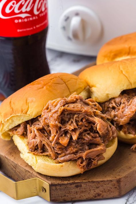 hamburger with coca cola pulled pork on a wooden board. Derby Appetizers, Bbq Pork Crockpot, Crockpot Pulled Pork Bbq, Pork Roast Crock Pot Recipes, Can Of Coke, Pork Barbecue, Crockpot Pork Roast, Pot Roast Crock Pot Recipes, Slow Cooked Pulled Pork