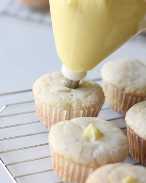 Coconut cupcakes - filled with coconut filling - topped with coconut cream cheese frosting. If you love coconut cake - these cupcakes are the ultimate! Coconut Cupcake Filling, Coconut Filled Cupcakes, Coconut Cupcakes With Filling, Coconut Cupcakes From Cake Mix Boxes, Decorated Pies, Cupcake Fillings, Desserts Coconut, Coconut Cream Filling, Cupcakes Coconut