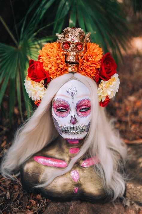 Step into the essence of Día de los Muertos with this mesmerizing Golden Skull Crown, a tribute to the beauty of remembrance and celebration. 🌼✨  Handmade with exquisite detail, this La Catrina headdress features a gilded skull centerpiece, surrounded by vibrant marigold and red roses--symbols of love, memory, and the connection between worlds. Perfect for Día de los Muertos, Mexican festivals, themed weddings, or Halloween, this headpiece ensures you embody both grace and mystery. Lightweight yet striking, it offers comfortable wear while making a powerful statement. Each crown is handcrafted with love and can be customized to fit your unique vision. Explore even more breathtaking crowns in our shop: www.carbickovacrowns.com DELIVERY 🚚 Each of our crowns is lovingly handcrafted to showc Gothic Tiara, Skull Centerpiece, Skull Crown, Marigold Flower, Themed Weddings, Costume Halloween, Love Symbols, Headdress, Headpiece