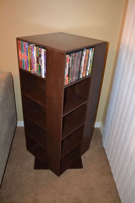 diy spinning dvd rack end table Diy Dvd Shelves, Dvd Storage Ideas, Dvd Storage Cabinet, Diy Dvd Storage, Diy Dvd, Apartment Ideas Living Room, Dvd Rack, Dvd Shelves, Cd Dvd Storage