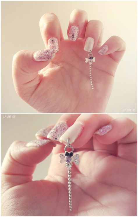 I wouldn't get this one but I really wanna try nail piercing Nail Chain Design, Chain Nail Art Design, Nails With Dangly Charm, Hanging Nail Charms, Dangle Nail Charm, Diamond Nail Designs, Fingernails Painted, Nail Piercing, Hello Nails