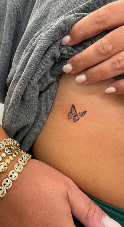 https://encrypted-tbn0.gstatic.com/images?q=tbn:ANd9GcQoVuZ4_RDp5fi6_CMnJaD2Ljag8JkmE5S8mg&usqp=CAU Singular Butterfly Tattoo, Christian Butterfly Tattoo, Tattoo Ideas Female Back Of Arm, Tattoo Ideas Female Aesthetic, Butterfly Tattoo Hip, Small Butterfly Tattoo Designs, Fine Line Butterfly Tattoo, Line Butterfly Tattoo, Fine Line Butterfly