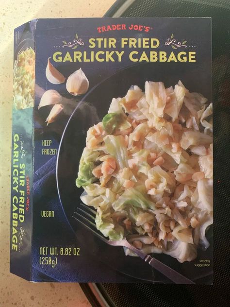 The front package of Trader Joe's Stir Fried Garlicky Cabbage. Garlicky Cabbage, Trader Joes Vegan, Vegan Essentials, Vegan Grocery, Florida Food, Tasty Meals, Meat Alternatives, Baked Tofu, Sandwiches For Lunch