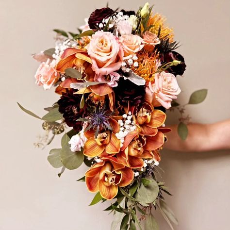 Autumn cascading bridal bouquet featuring rust cymbidium orchids | Instagram Orchid Bouquet Wedding, Cascading Bridal Bouquets, Orange Orchid, Orchid Bouquet, Orchid Wedding, Cymbidium Orchids, Fall Flowers, Bridal Bouquet, Flowers Bouquet