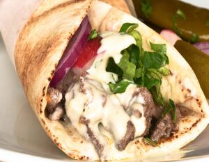 Beef Shawarma Recipe, Lebanese Shawarma, Beef Shawarma, Baked Rice Pudding, Lemon Tahini Sauce, Shawarma Recipe, Tender Meat, Lebanese Cuisine, Beef Strips