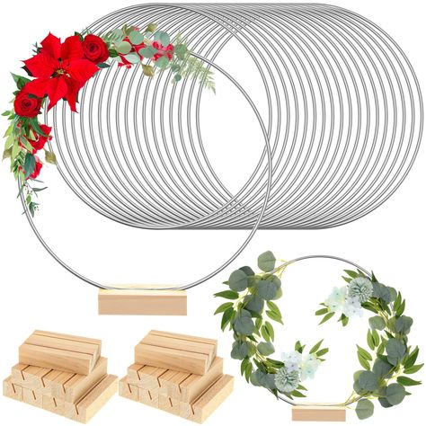 PRICES MAY VARY. What You Will Get: the package comes with 18 pieces of wreath macrame hoop rings and 18 pieces of wood place card holders, sufficient quantity and good collocation for you to decorate and replace, you can share them with your family Reliable Material: made of metal, these round centerpieces for tables have a smooth surface, safe for you to use, and the stand is made of quality wood, solid and trusted, sturdy and not easy to break, deform, rust or fade, can serve you for a long t Centerpiece With Metal Ring, Family Tree Centerpiece, Simple Paper Centerpieces, Wreath Potted Plants Wedding Centerpiece, Grave Wreath Holder, Plastic Fadora Centerpieces, Table Centerpieces For 90 Birthday, Floral Hoop Table Centerpiece, Table Leg Wreath Holder