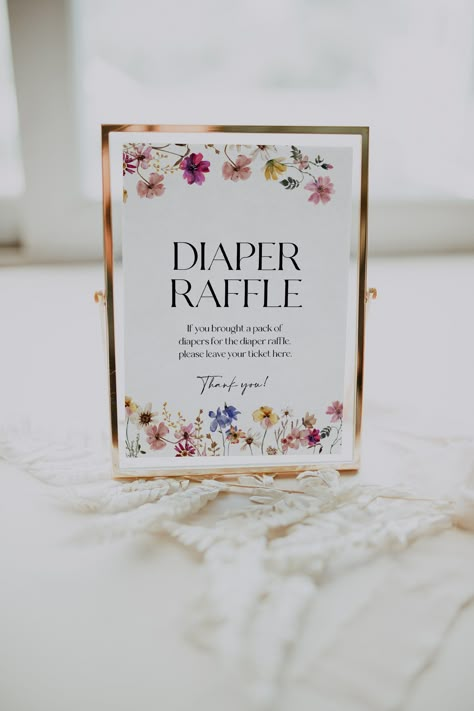 Baby shower Diaper Raffle sign template with colorful flowers and wildflowers. Instant access through Templett, fully customizable, no software needed.  Check the demo and coordinating templates using the links below. Ⓜ️ MATCHING TEMPLATES:  https://etsy.me/3CqImOr (copy the link in a web browser) 📦WHAT IS INCLUDED: Diaper raffle sign: 5x7 and 8x10 inches 💻 DEMO LINK: https://templett.com/design/demo/visual/20922467,20922468 🖨️ PRINT using our partner's reliable printing service:  https://bit Flower Baby Shower Theme, February Baby Showers, Floral Baby Shower Decorations, Flower Baby Shower, Diaper Raffle Sign, Wildflower Baby Shower, Elegant Baby Shower, Sprinkle Baby Shower