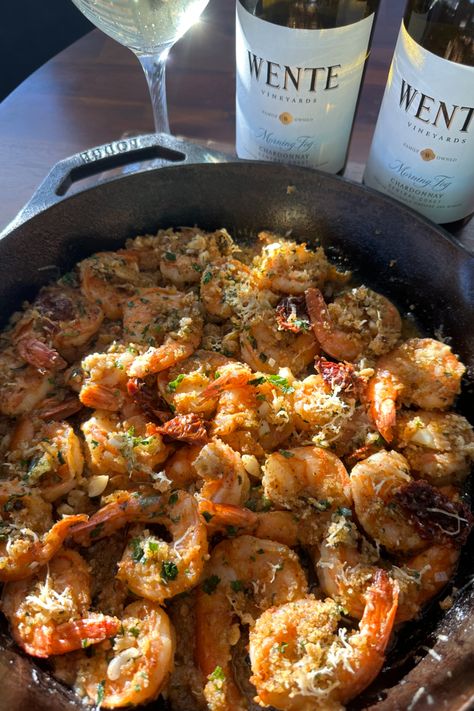 This Garlic Butter and Herb Crusted Shrimp Bake is a showstopping, flavorful dish that’s perfect for any occasion. Succulent, colossal shrimp are coated in a delicious blend of garlic, fresh herbs, and buttery breadcrumbs, then baked to perfection with tangy sun-dried tomatoes and a splash of Wente Vineyards Morning Fog Chardonnay. This easy-to-make, crowd-pleasing recipe is finished with a crisp, golden crust and served with a garlicky pan sauce that’s perfect for dipping crusty bread. Crusted Shrimp, Shrimp Bake, Colossal Shrimp, Butter Herb, Baked Shrimp Recipes, Flavorful Shrimp, Pan Sauce, Baked Shrimp, Crowd Pleasing Recipes