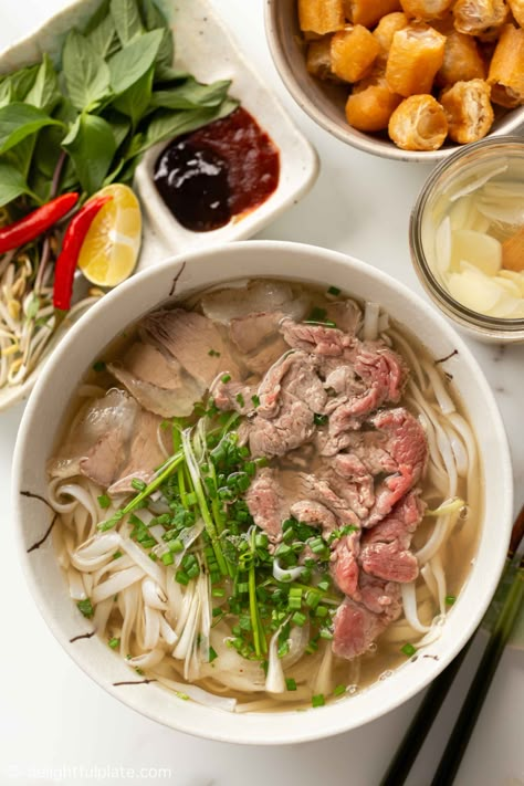 Phở Bò (Vietnamese Beef Pho Noodle Soup) is the national dish of Vietnam, a dish that many Vietnamese hold dear to their heart. Learn the authentic way to make beef pho and serve it like a true Vietnamese, as well as cooking tips you may not find elsewhere. Pho Soup Recipe, Pho Beef, Bowl Of Pho, Pho Noodle Soup, Salad Add Ins, Vietnamese Beef, Vietnamese Soup, Pho Noodles, Pho Recipe