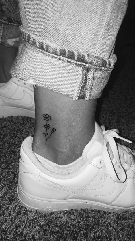 Ankle tattoo
Flower tattoo 
Small Ankle Simple Tattoos, Tattoo Ideas Female Small Ankle, Small Flower Tattoos On Ankle, Tiny Flower Ankle Tattoo, Flower Tattoo On Ankle For Women, Cute Simple Ankle Tattoos, Tatoos Cute Small Simple, Small Daisy Tattoo Ankle, Dainty Flower Ankle Tattoo