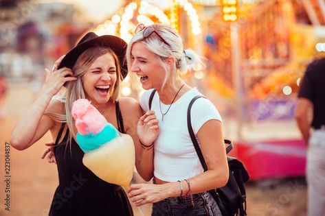 Stock Image: Shot of happy female friends in amusement park eating cotton candy. Two young women enjoying a day at amusement park. Eating Cotton Candy, Ying Yang Twins, Amusement Park Outfit, Big And Rich, Thrill Ride, Cruise Port, Park Photos, Female Friends, Travel Tours