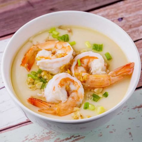 A soft , comforting and tasty preparation of steamed egg custard topped with shrimps and seasoning.Chinese steamed egg with shrimp; this is an easy healthy dish. Take less than 10 minutes to make and it is soft like pudding. Very delicious.Steamed egg custard is a beloved everyday dish in China. The smooth custard is easy to make and incredibly pleasurable and comforting. It’s arguably one of the first dishes that many Chinese learn to cook when they’re young, inevitably becoming an old standby Korean Steamed Egg, Steam Egg, Steamed Egg Custard, Chinese Learn, Shrimp Appetizer Recipes, Shrimp Appetizer, Marinated Shrimp, Steamed Eggs, Shrimp Appetizers