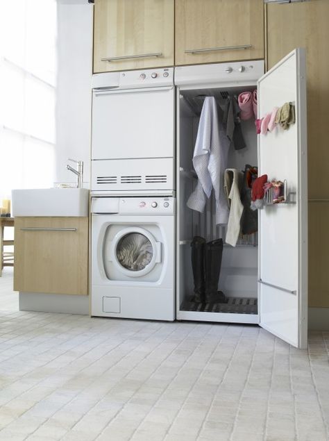 Drying Cabinet. It uses the heat radiated from the dryer to gently warm clothes that can not be put in the dryer. Drying Cupboard, Drying Cabinet, Entryway Designs, Laundry Room Appliances, Long Cabinet, Laundry Room Drying Rack, Ideas Entryway, Tiny Laundry Rooms, Hockey Gear