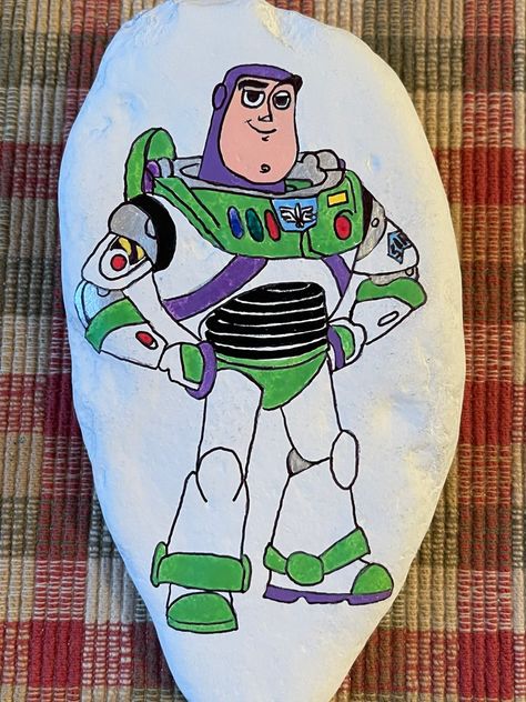 Buzz Lightyear Painting, Diy Rock Art, Rock Painting Art, Buzz Lightyear, Dec 8, Painted Rock, Acrylic Paintings, Rock Painting, Rock Art