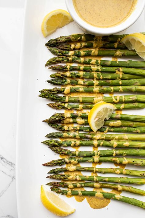 spread out baked asparagus with lemon sauce drizzled on top Ginger Asparagus, Wfpb Sauces, Butter Asparagus, Lemon Ginger Turmeric, Spring Dishes, Wfpb Recipes, Ginger Sauce, Vegan Side Dishes, Vegan Sides