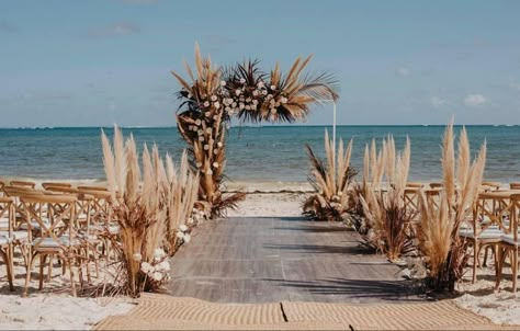 Boho Beach Wedding Aisle Decor, Beach Wedding Ceremony Set Up, White And Beige Beach Wedding, Boho Wedding Beach Decoration, Fall Beach Wedding Colors, Boho Beach Wedding Arch, Rarotonga Wedding, Pampas Grass Beach Wedding, Beach Wedding Pampas Decor