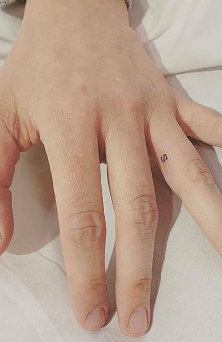 Small Initial Finger Tattoo, Cute Ring Finger Tattoos, Inner Ring Finger Tattoo, Finger Micro Tattoo, Tattoos In Between Fingers, S Tattoo On Finger, Small Wedding Tattoos, Finger Wedding Tattoo, Small Letter Tattoo On Finger