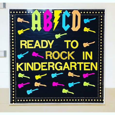 AB⚡️CD! Ready to ROCK in kindergarten!    #teacher #bulletinboard #kindergarten #kindergartenclassroom #backtoschool Rock And Roll Themed Bulletin Boards, Kindergarten Rocks Bulletin Board, Rock And Roll Door Theme, Rock Star Bulletin Board, Rockstar Bulletin Board Ideas, Our School Rocks Theme, Rock Theme Classroom, Kindergarten Round Up Themes, Rock N Roll Bulletin Board