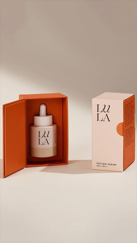 4f37801b051a40fd411c40b3659e8334 Luxury Lula Potion Serum in elegant packaging, emphasizing high-end skincare. Cream and orange box highlighting product design. | Sky Rye Design Packaging Design For Skincare, Luxury Serum Packaging Design, Cosmetic Brand Packaging, Creative Cosmetic Packaging, Creative Skincare Packaging, Serum Package Design, Skin Care Package Design, Product Design Skincare, Serum Bottle Packaging